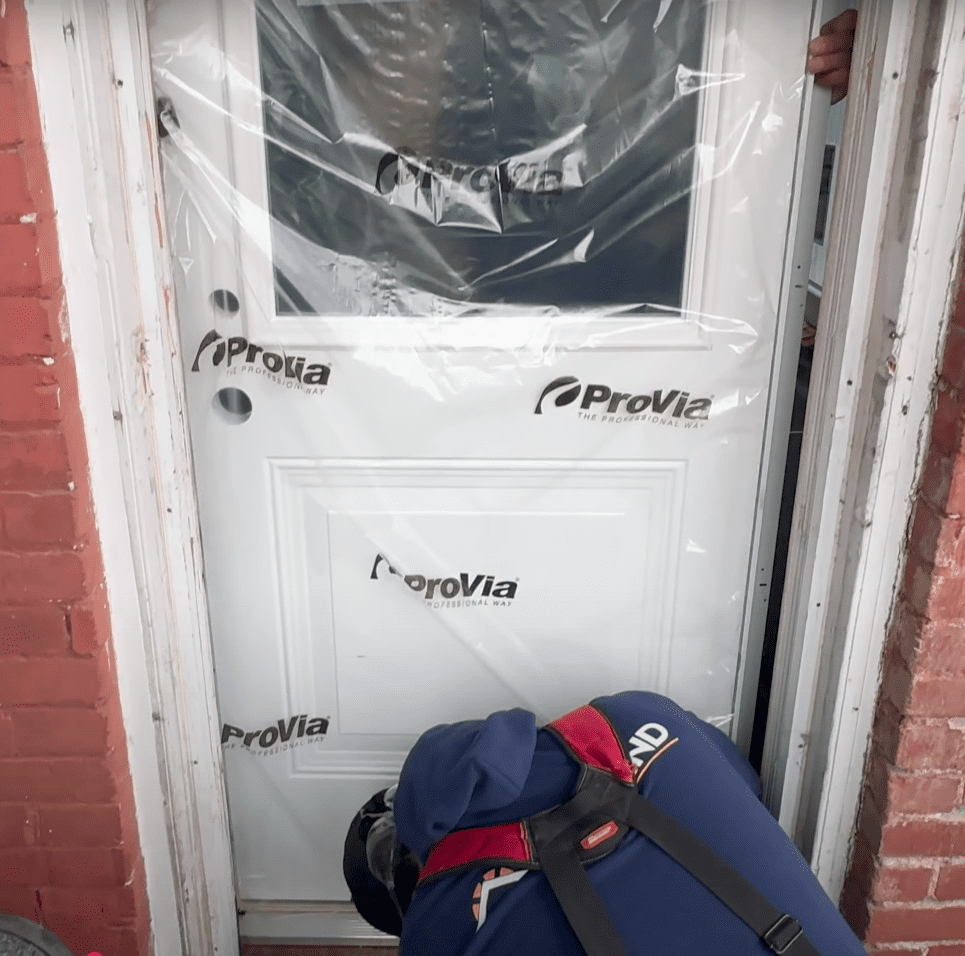 Worker installing a new residential door